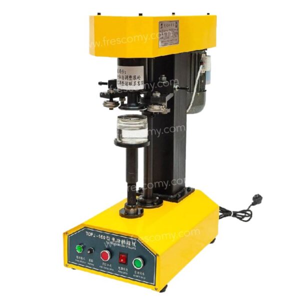 The Pop Corn Can Bottle Sealing Machine Yellow FET-AP557 with control buttons is sealing a glass jar against a white background.