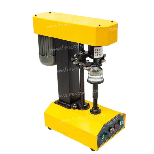 The Pop Corn Can Bottle Sealing Machine Yellow FET-AP557, featuring control buttons for precise sealing of glass jars or Pop Corn Cans, is shown with a jar placed under the capping mechanism.