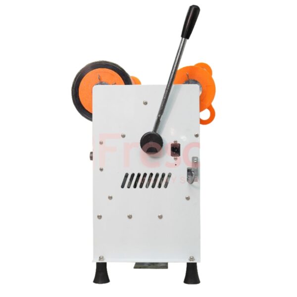 The Semi Auto Cup Sealing Machine FET-B7 has a white and orange body, black handle, two orange rollers, and stands upright on four black legs.