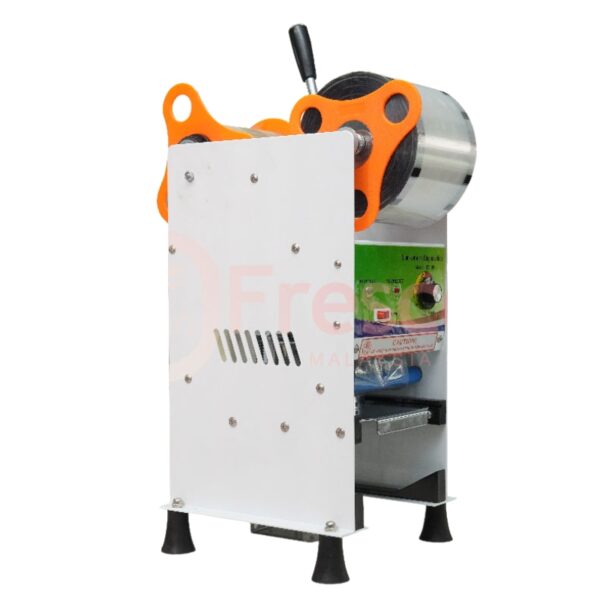 The Semi Auto Cup Sealing Machine FET-B7 has a sturdy metal body, orange handles, and a top-mounted plastic film roll—ideal for fast and efficient drink cup sealing in commercial environments.