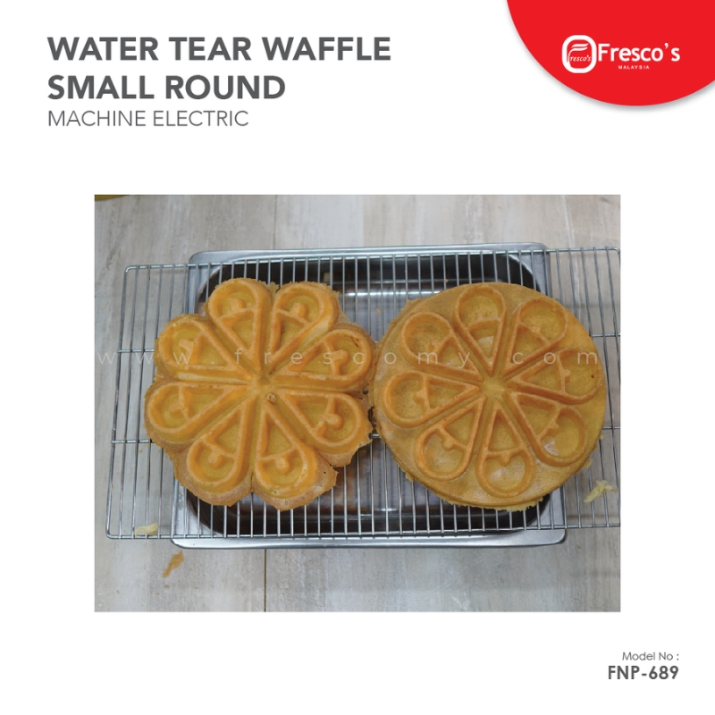 Two round, heart-segmented waffles cool on a rack, resembling a Waffle Flower—showcasing the Waffle Flower Water Tear Maker Electric FNP-689.