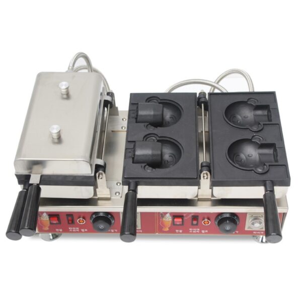 The Waffle Bear Ice Cream Machine Electric FNP-903 has two sets of cartoon animal face molds, plus control knobs and handles for easy use. Its stainless steel build ensures durability in commercial settings.
