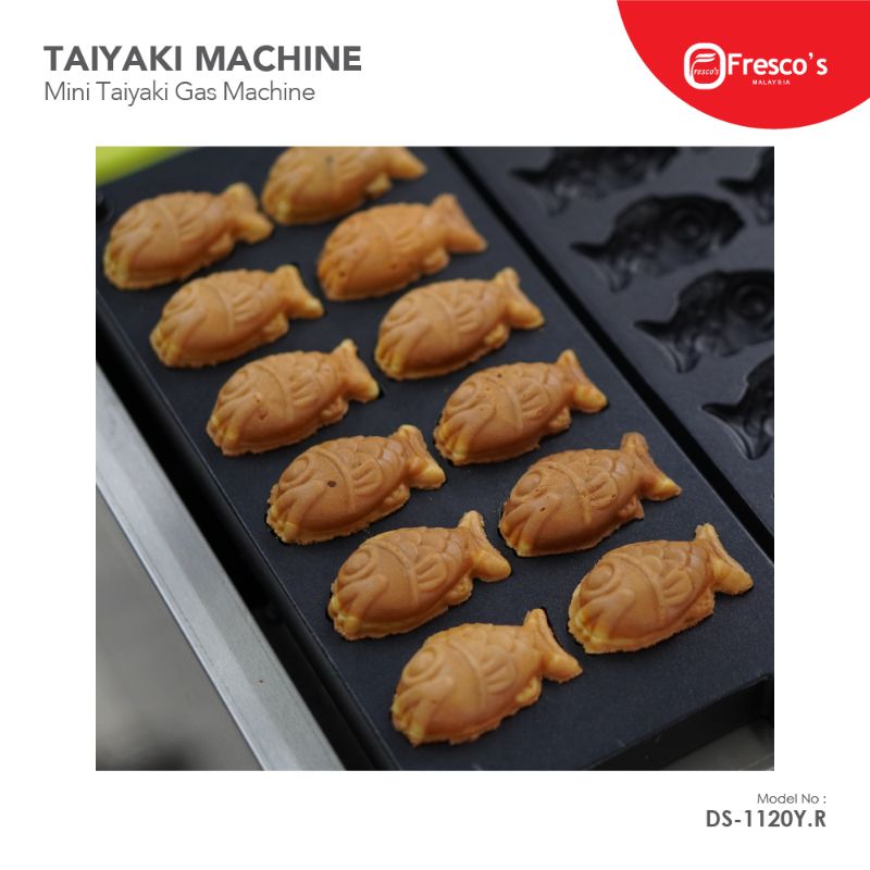 A tray of freshly baked mini fish-shaped taiyaki pastries sits on the Taiyaki Fish Waffle Maker Fish Shape Gas Machine DS-1120Y.R, with unused molds visible beside them.
