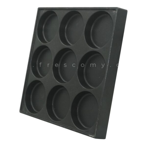 The 6 Holes Waffle Telur Burger Mould Spare Part Mold is a black, square tray with six round, shallow compartments, ideal as a spare part or for shaping treats like waffle telur.