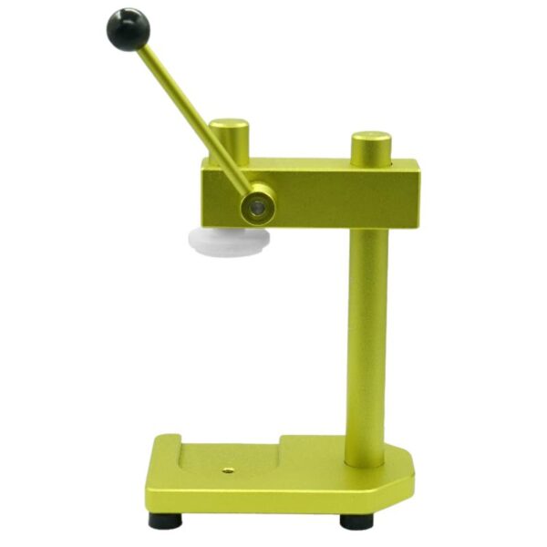 The PET Can Bottle Sealing Manual Machine is a green metal device with a black-tipped lever and a white circular plate on a flat base, ideal for sealing PET can bottles.