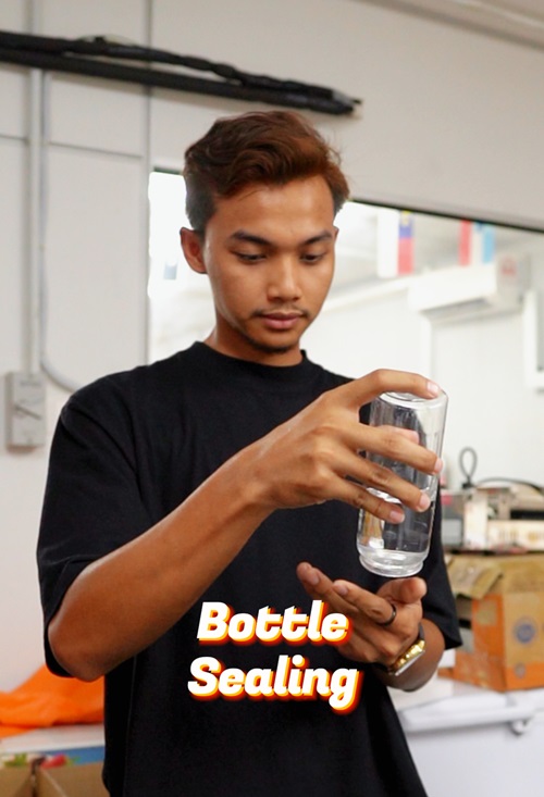 A man in a black shirt holds a clear glass upside down over his hand; the words "Bottle Sealing" appear in bold text at the bottom, highlighting innovative drink sealer techniques.